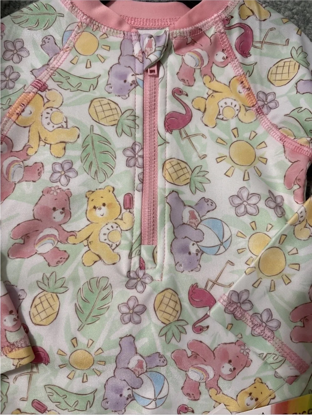 Care Bears Pastel Multicolor Pink-Trim UPF 50+ Baby Swim Romper One Piece NWT